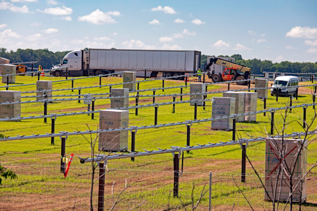 Boxes of solar panels await installation at a solar farm construction site on June 24, 2024, in Albion, Mich. Credit: Jim West/UCG/Universal Images Group via Getty Images