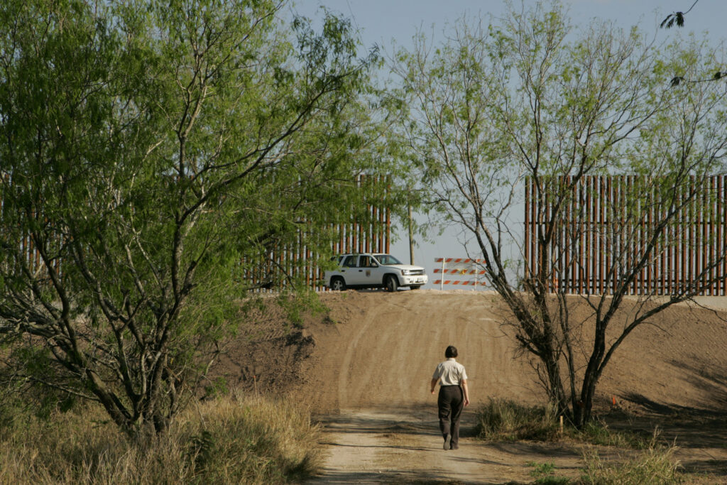 The border wall is seen in the Lower Rio Grande Valley National Wildlife Refuge. Credit: Steve Hillebrand/USFWS