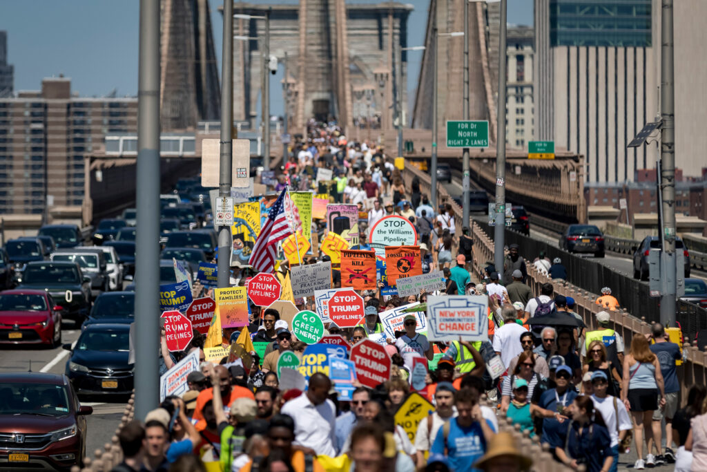 Activists march across the Brooklyn Bridge to demand that Gov. Kathy Hochul stop the construction of the Williams pipeline in New York. Credit: Michael Nigro/Pacific Press/LightRocket via Getty Images