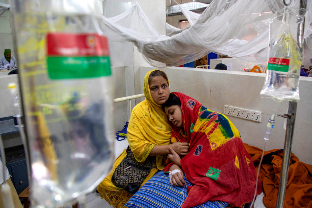 A woman sits along with her daughter suffering from dengue fever at Shaheed Suhrawardy Medical College and Hospital on Nov. 4, 2024, in Dhaka, Bangladesh. Credit: Abdul Goni/AFP via Getty Images