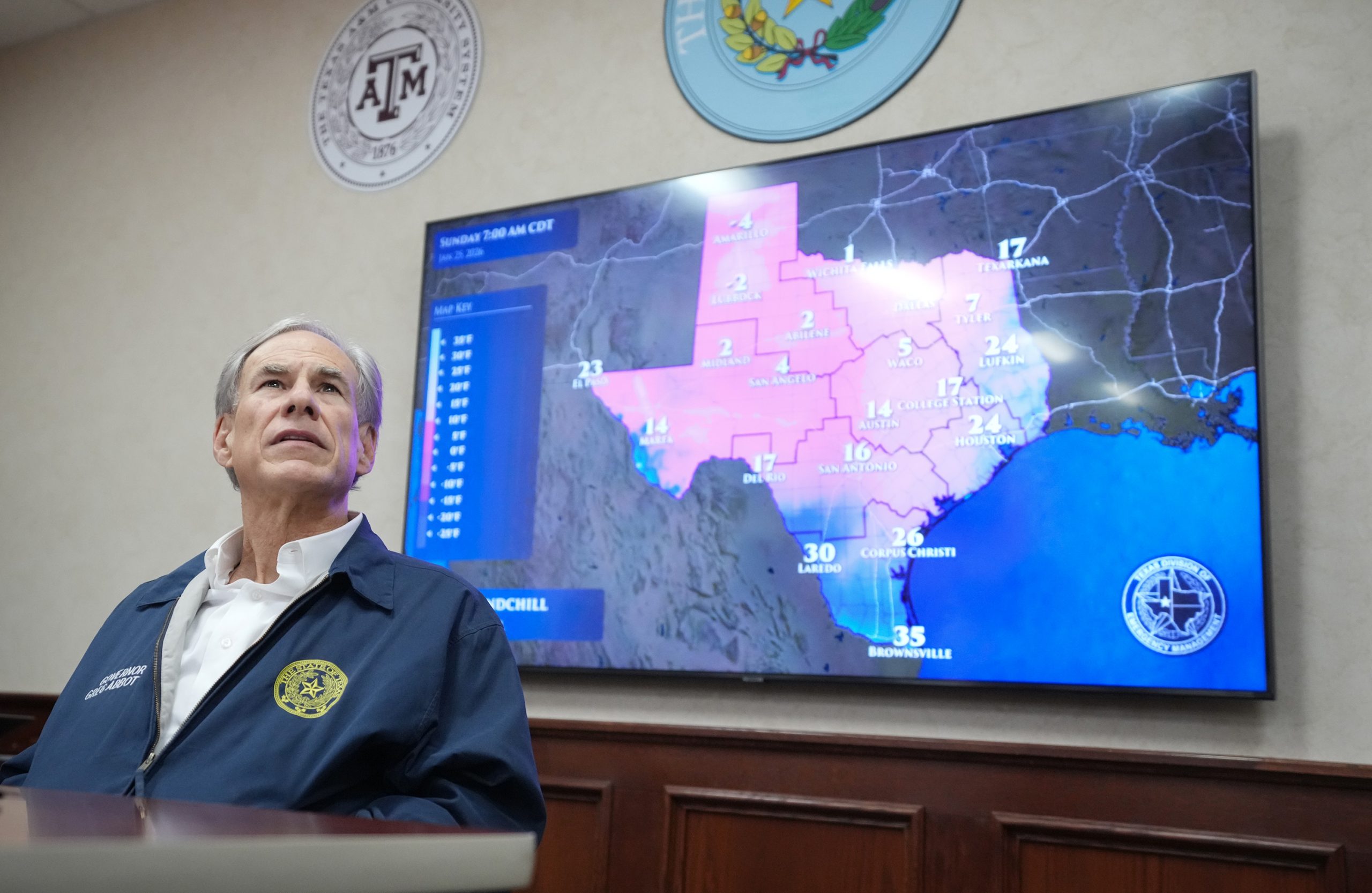 Texas Gov. Greg Abbott listens to a briefing as he prepares for a winter storm at the State Operations Center in Austin. Credit: Jay Janner/The Austin American-Statesman via Getty Images