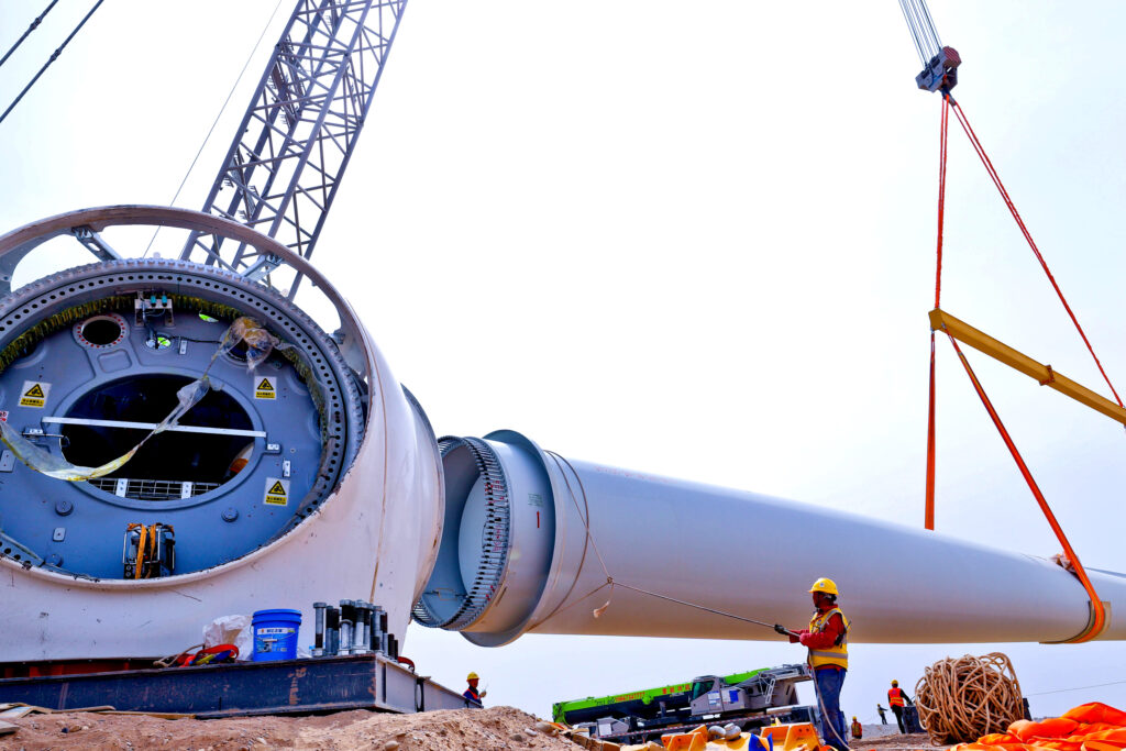 Workers assemble wind turbine blades at the construction site of a wind farm in Zhangye City, China, on April 17, 2025. Credit: CFOTO/Future Publishing via Getty Images