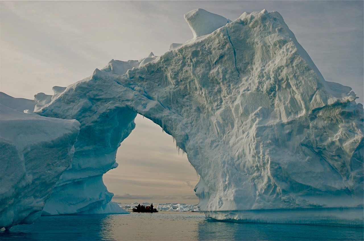 Researchers and tourists explore the edge of an ice shelf along the Antarctic Peninsula, which has warmed faster than nearly any other region in the past few decades. Credit Bob Berwyn/Inside Climate News