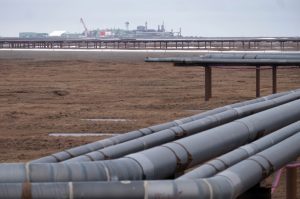Oil pipelines stretch across the landscape outside Nuiqsut, Alaska, where ConocoPhillips operates the Alpine Field. Credit: Bonnie Jo Mount/The Washington Post via Getty Images