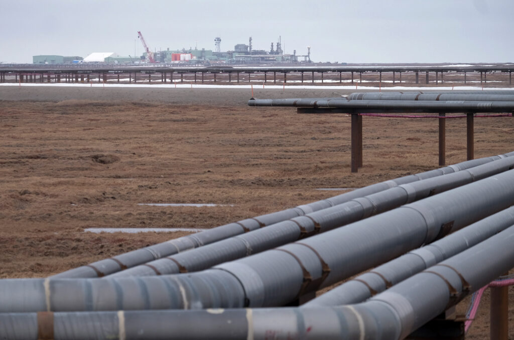 Oil pipelines stretch across the landscape outside Nuiqsut, Alaska, where ConocoPhillips operates the Alpine Field. Credit: Bonnie Jo Mount/The Washington Post via Getty Images