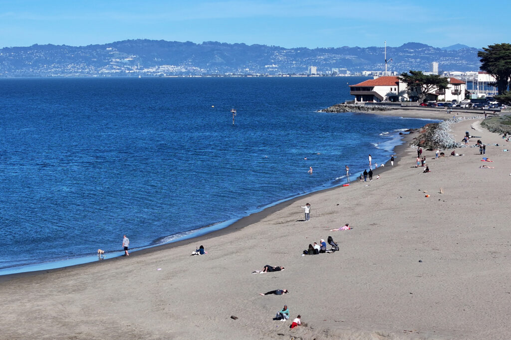 People spend time on Crissy Field Beach during warm weather in San Francisco on March 11. Credit: Tayfun Coskun/Anadolu via Getty Images
