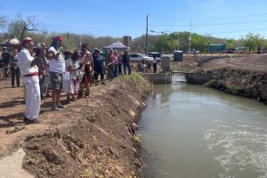 Community members participate in a blessing ceremony of the Atrisco Acequia Madre in Albuquerque, N.M. Credit: Tina Deines/Inside Climate News