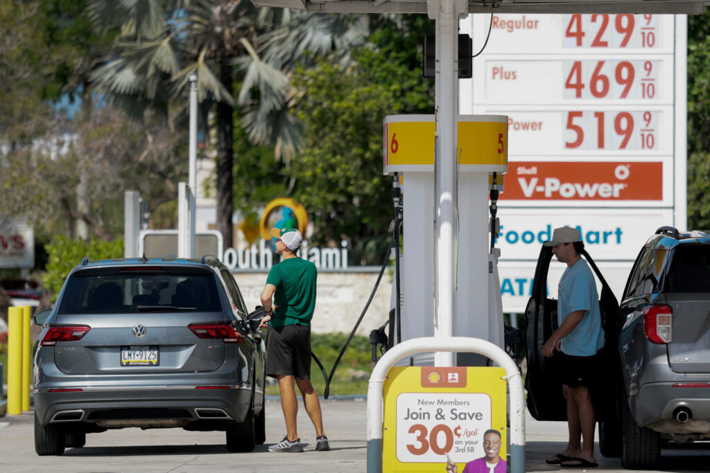 People fill their vehicles at a gas station in Miami on Monday. Credit: Joe Raedle/Getty Images