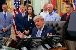 President Donald Trump is joined by grocery store owners and supermarket corporation executives as he announces regulatory rollbacks on chemical refrigerants at the White House on May 21. Credit: Chip Somodevilla/Getty Images