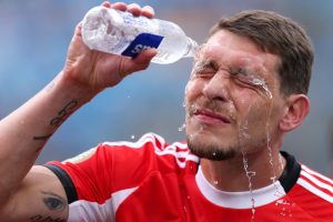 Andrea Belotti of S.L. Benfica pours water on his face to cool off during a FIFA Club World Cup match at Bank of America Stadium on June 28, 2025, in Charlotte, N.C. Credit: Justin Setterfield/FIFA via Getty Images