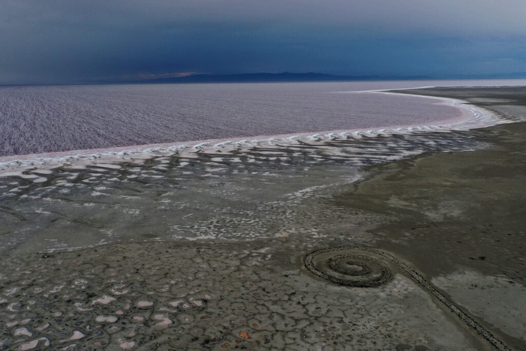 The Spiral Jetty, constructed by artist Robert Smithson in 1970, sits near the Great Salt Lake’s water on Aug. 1, 2021 in Utah. Credit: Justin Sullivan/Getty Images