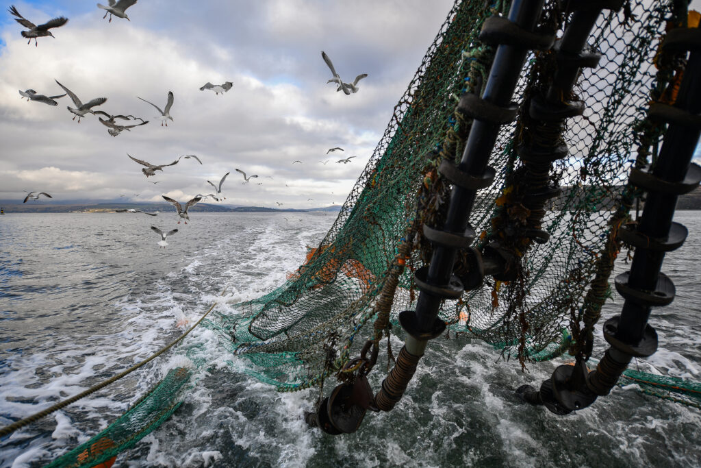 A fishing trawler drags its net through the waters near Greenock, Scotland, on March 5, 2019. Credit: Jeff J Mitchell/Getty Images