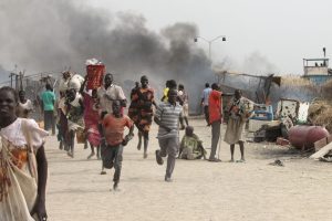 People flee a U.N. base, where gunmen opened fire on South Sudanese civilians sheltering inside, in the town of Malakal on Feb. 18, 2016. Scientists tracing links between climate impacts and conflicts found that some regions can tip toward violence when they reach extreme drought tipping points. Credit: Justin Lynch/AFP via Getty Images