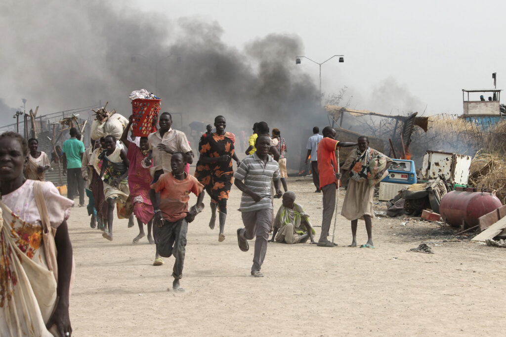 People flee a U.N. base, where gunmen opened fire on South Sudanese civilians sheltering inside, in the town of Malakal on Feb. 18, 2016. Scientists tracing links between climate impacts and conflicts found that some regions can tip toward violence when they reach extreme drought tipping points. Credit: Justin Lynch/AFP via Getty Images
