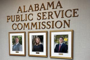 Photos of current Alabama Public Service Commissioners hang in the PSC offices. Chris Beeker (right) lost his reelection bid against Republican opponent Jim Zeigler. Credit: Dennis Pillion/Inside Climate News