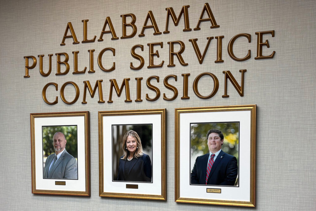 Photos of current Alabama Public Service Commissioners hang in the PSC offices. Chris Beeker (right) lost his reelection bid against Republican opponent Jim Zeigler. Credit: Dennis Pillion/Inside Climate News