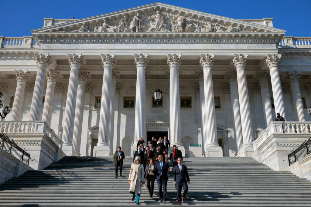 House Democrats walk down the steps of the Capitol before a news conference on Dec. 18, 2025, in Washington, D.C. Credit: Chip Somodevilla/Getty Images