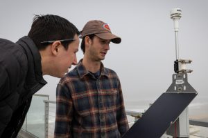 Researchers look at an air quality monitor on April 10, 2025, in Imperial Beach, Calif. Credit: Ana Ramirez/The San Diego Union-Tribune via Getty Images