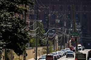 Power lines run along a neighborhood in Philadelphia. Credit: Matthew Hatcher/AFP via Getty Images