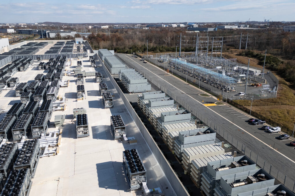 Data center cooling fans and generators operate next to a power substation in Ashburn, Va., on Nov. 12, 2025. Credit: Andrew Caballero-Reynolds/AFP via Getty Images