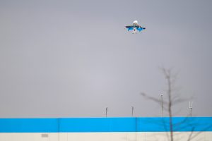 A delivery drone takes off from Amazon’s SXT8 warehouse in Richardson, Texas. Credit: Andrew Liu/Inside Climate News