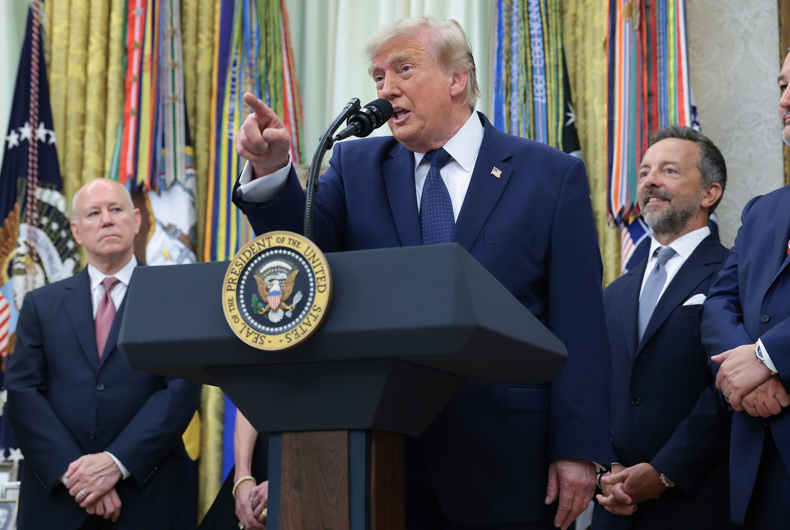 President Donald Trump talks to reporters in the Oval Office on Monday about the energy demands of AI and data centers. Credit: Anna Moneymaker/Getty Images