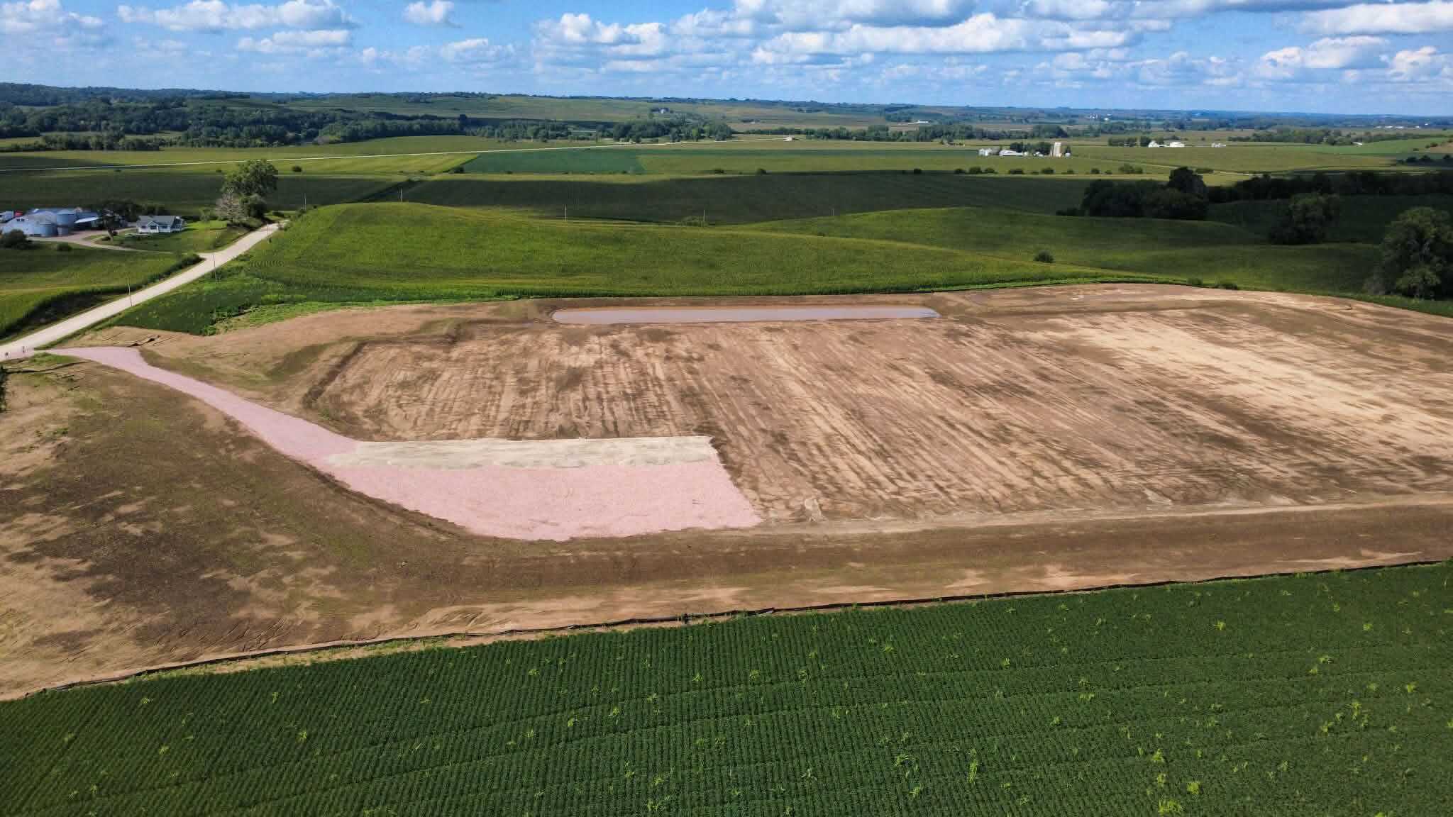 A former soybean field and six-acre earthen basin in Castana, Iowa, where a private developer planned to dump dehydrated manure from an out-of-town slaughterhouse. Credit: Scott Koepsell