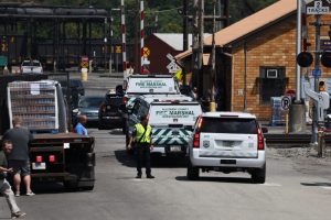 Allegheny County Fire Marshal vehicles are seen near the entrance to U.S. Steel’s Clairton Coke Works following an explosion at the plant on Aug. 11, 2025. Credit: Rebecca Droke/AFP via Getty Images