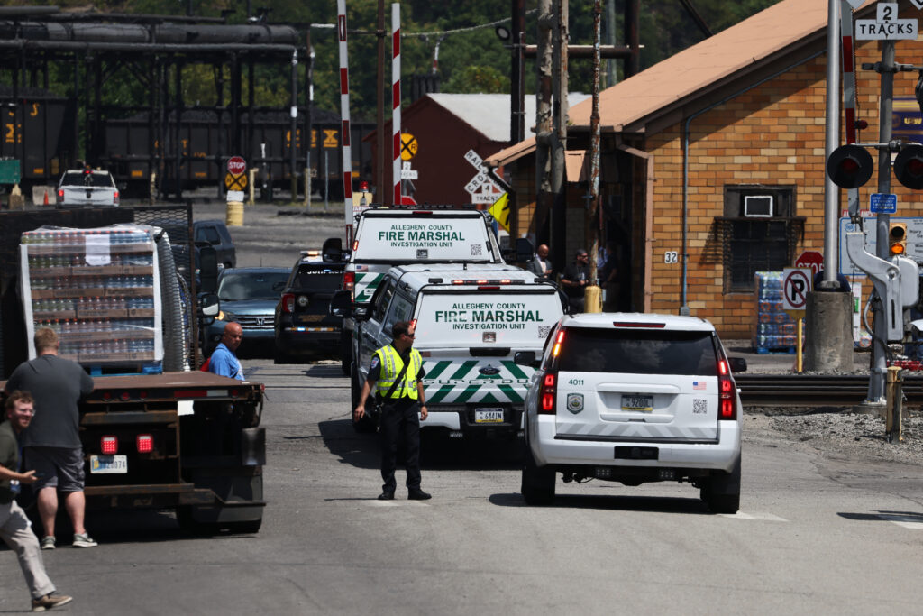 Allegheny County Fire Marshal vehicles are seen near the entrance to U.S. Steel’s Clairton Coke Works following an explosion at the plant on Aug. 11, 2025. Credit: Rebecca Droke/AFP via Getty Images