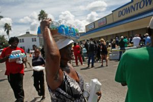 Belle Glade residents receive food and water in the wake of Hurricane Irma on Sept. 13, 2017. Credit: Brian Blanco/Getty Images