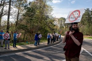 Protesters gather at the near the site of a proposed data center development in Lusby, Md., on April 6. Credit: Nathan Howard/The Washington Post via Getty Images