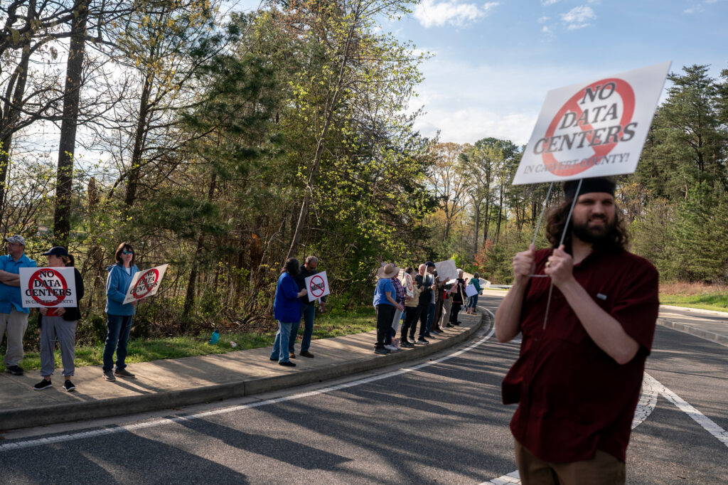 Protesters gather at the near the site of a proposed data center development in Lusby, Md., on April 6. Credit: Nathan Howard/The Washington Post via Getty Images