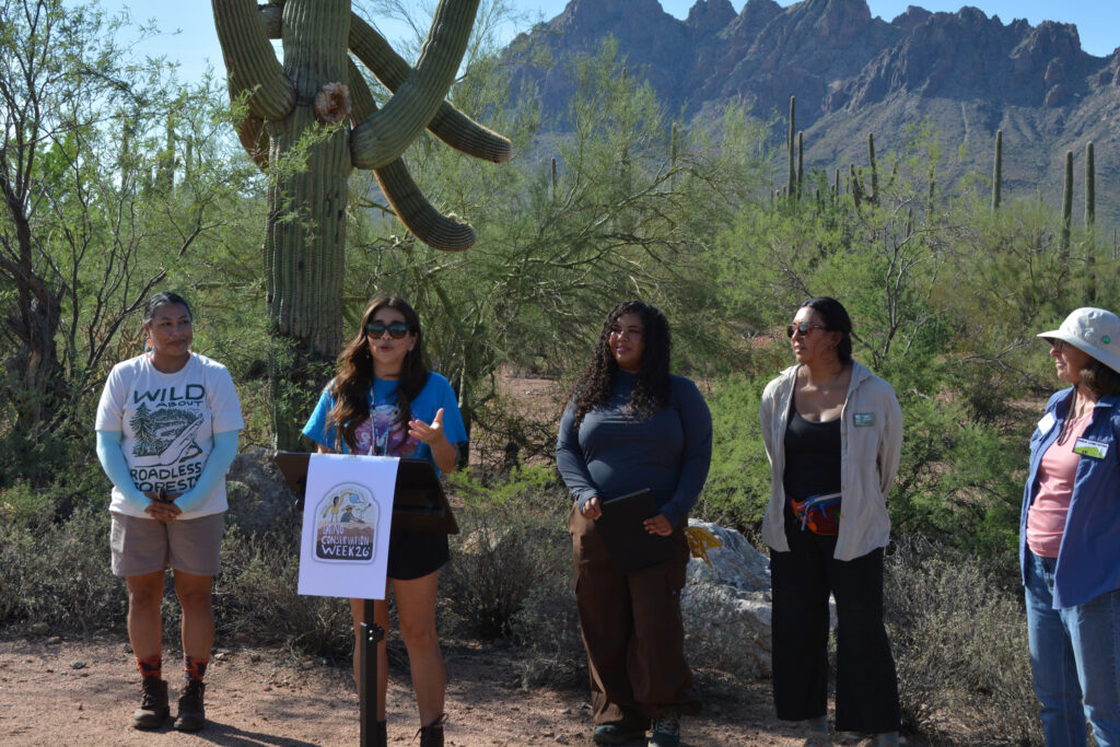 Cassandra Becerra, the Arizona State Director for Mountain Mamas, speaks at a press conference on Saturday kickstarting Latino Conservation Week and highlighting the threats facing Ironwood Forest National Monument. Credit: Wyatt Myskow/Inside Climate News