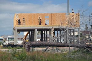 Workers rebuild a home destroyed by Hurricane Michael on May 9, 2019, in Mexico Beach, Fla. Credit: Scott Olson/Getty Images