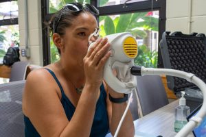 A MauiWES participant takes a lung function test as University of Hawai‘i researchers track the health impacts of the August 2023 wildfires. Credit: Keerti Gopal/Inside Climate News