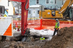 Workers repair a water main break that flooded streets and homes in southwest Detroit in February 2025. Credit: Jim West/UCG/Universal Images Group via Getty Images