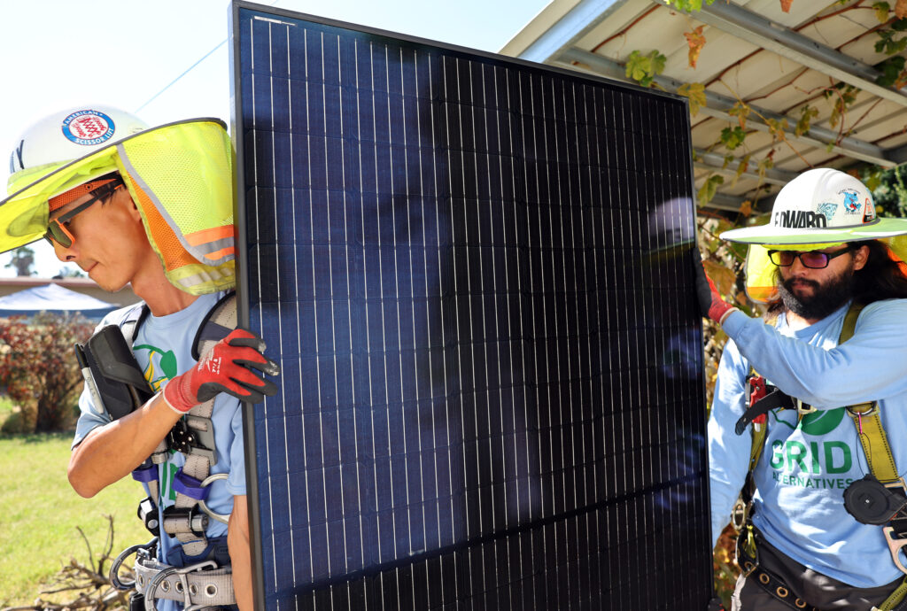 Workers install no-cost solar panels on the rooftop of a low-income house on Oct. 19, 2023, in Pomona, Calif. Credit: Mario Tama/Getty Images
