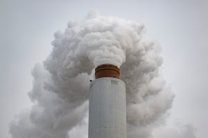 A flue-gas stack blows exhaust at a coal-fired power plant in Ghent, Ky., on Feb. 14. Credit: Jon Cherry/Getty Images