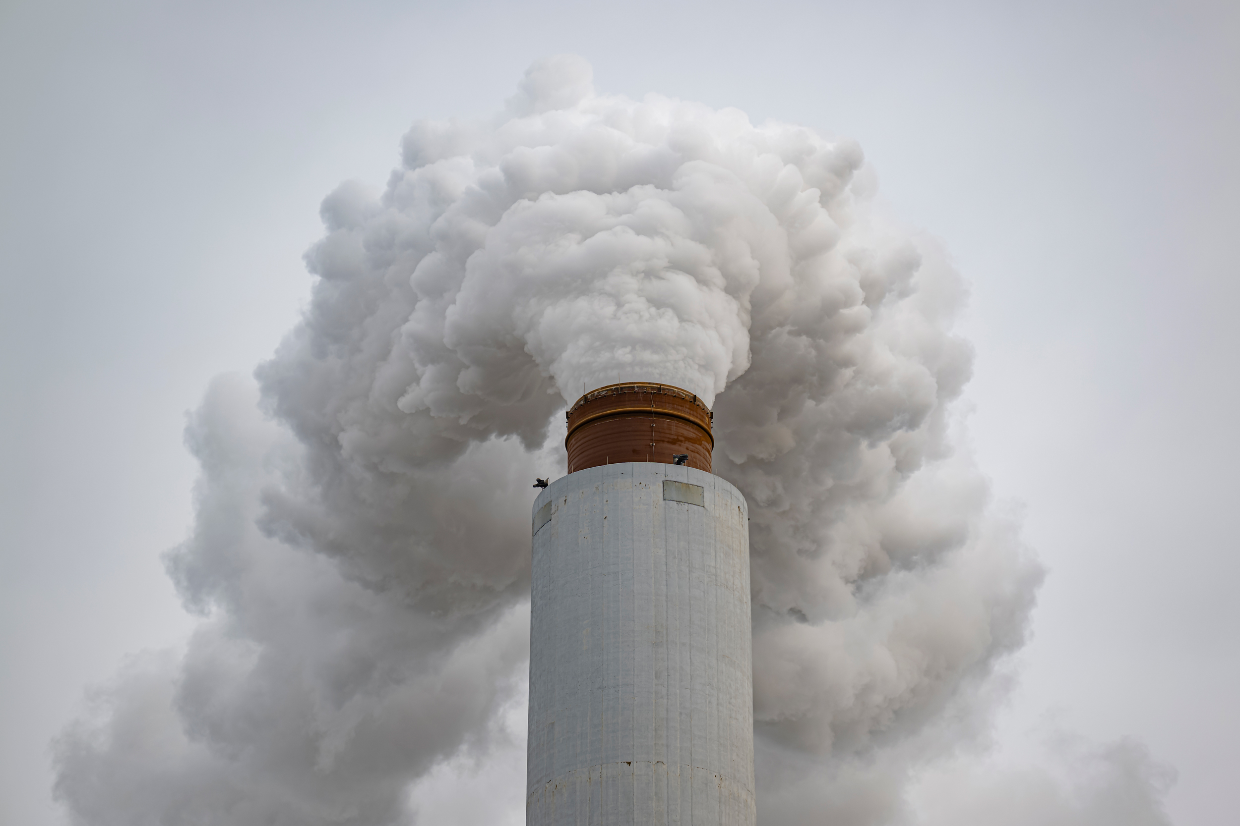 A flue-gas stack blows exhaust at a coal-fired power plant in Ghent, Ky., on Feb. 14. Credit: Jon Cherry/Getty Images