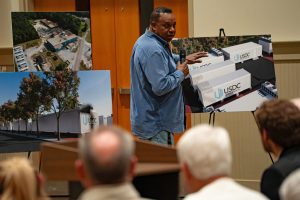 Errol Peart with DigiPowerX speaks with community members about the company