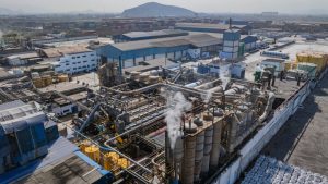 Smoke rises from a fishmeal factory in 2025 near a residential community in Callao, Peru. Credit: Ministry of Production of Peru