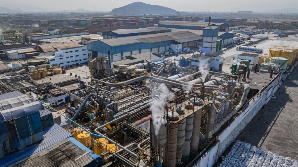 Smoke rises from a fishmeal factory in 2025 near a residential community in Callao, Peru. Credit: Ministry of Production of Peru