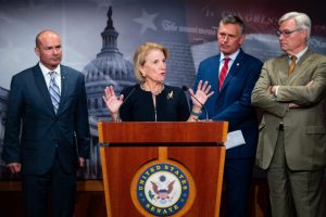 From left: Sen. Mike Lee (R-Utah), Sen. Shelley Moore Capito (R-W.Va.), Sen. Martin Heinrich (D-N.M.) and Sen. Sheldon Whitehouse (D-R.I.) hold a news conference on the Bipartisan American Affordability and Jobs Act in the U.S. Capitol on Sept. 30 . Credit: Bill Clark/CQ-Roll Call via Getty Images