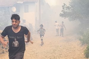 People evacuate after a wildfire swept through the village of Voden amid a heat wave in Bulgaria on July 17, 2024. Credit: Ivan Yanev/Bgnes News Agency/AFP via Getty Images