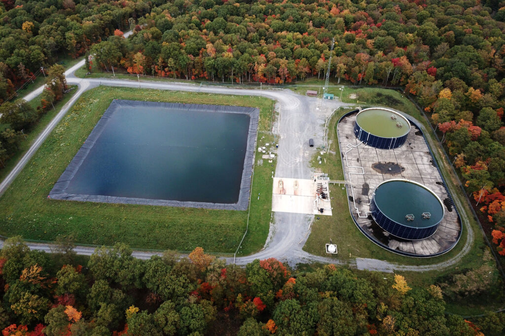 An oil wastewater pond and storage tanks at a site in Clearfield County, Pennsylvania. Credit: Ted Auch/FracTracker Alliance