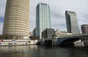 A canoer passes along the Hillsborough River among the office buildings downtown in Tampa, Florida, on Jan. 22, 2012. Credit: Linda Davidson/The Washington Post via Getty Images
