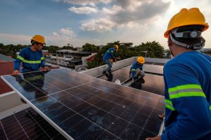 Workers install solar panels on the roof of a house in Antipolo, Philippines. Credit: Ezra Acayan/Getty Images