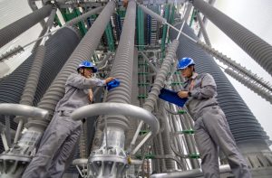 Maintenance workers clean substation equipment at in the Yanqing district of Beijing. Credit: CFOTO/Future Publishing via Getty Images